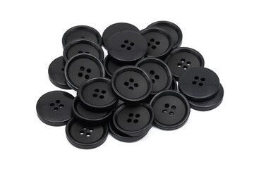 Black clothing buttons isolated on white. Pile of tailor accessories. Cutout circular button. Group of classic black round button.