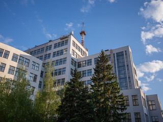evening blue sky and architecture of Derzhprom that a tall building built in soviet union era