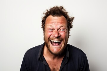 Portrait of a funny man shouting over white background. Looking at camera.