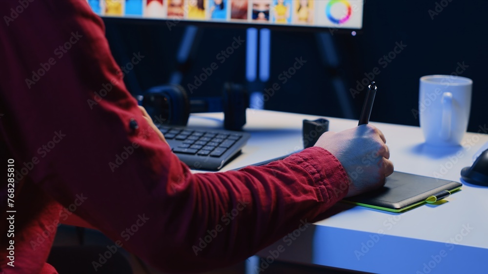 Aufkleber photographer using graphic tablet to perform editing operations to correct images in creative agency