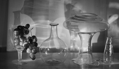 Wine grapes, decanter and various glass objects.Wine,autumn,season,zen concept,black and white,free copy space - 768287273