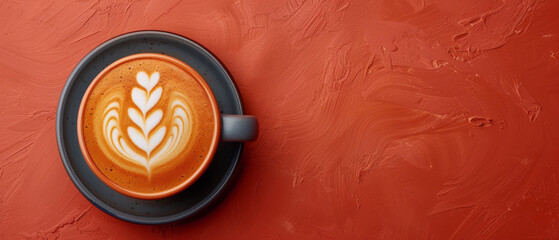 A soothing cup of coffee with detailed heart-shaped latte art on a red backdrop, evoking warmth and love