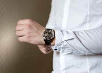 Hand of a man with watches