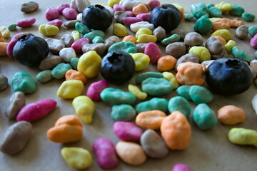Colorful candies on grey sweets background - obrazy, fototapety, plakaty