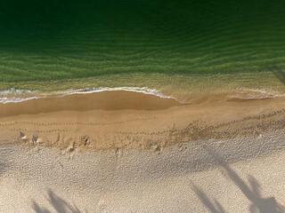 Drone footage showcasing the scenic Chahue Bay and its sandy coastline in Huatulco, Mexico