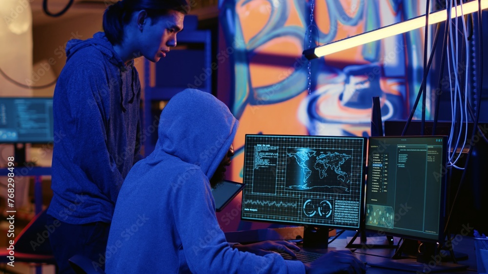 Poster hackers in dark room trying to steal valuable data by targeting governmental websites with weak secu