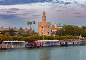 The famous Golden Tower in Seville at sunset. - 768306606