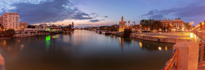 The famous Golden Tower in Seville at sunset. - 768307002