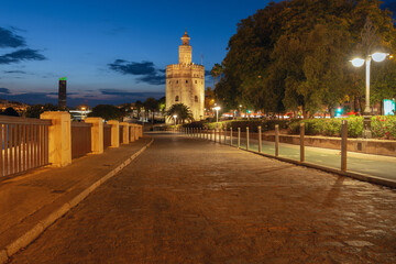 The famous Golden Tower in Seville at sunset. - 768307099