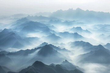 a panoramic view of a mountain range covered in mist at sunrise, evoking the vastness and beauty of nature
