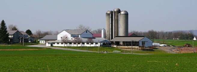 A large Amish farm with corn silos and a big field near Strasburg, Pennsylvania, U.S © Khairil