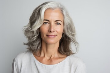 Portrait of a beautiful senior woman with grey hair looking at camera