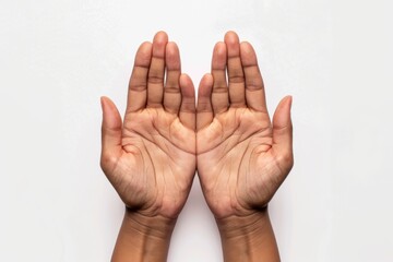 A close-up image capturing the detail and texture of two open hands with palms facing upward on a white backdrop