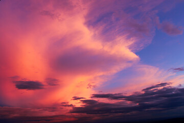 Colorful clouds at sunset. dance of clouds. purple and pink colored clouds. Dramatic and romantic sky.