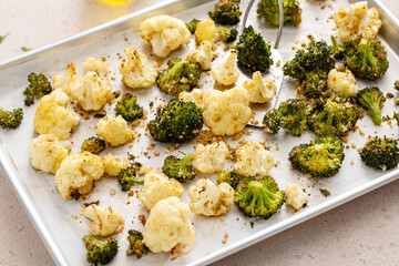 Roasted cauliflower and broccoli on a sheet pan, healthy vegetable side dish