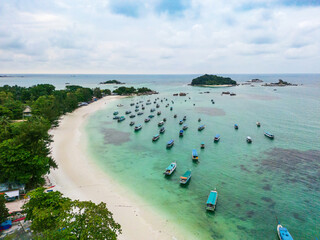 Belitung Kelayang beach and boats drone view. Beautiful aerial view of islands, sea and rocks in Belitung, Indonesia  © Marius Karp