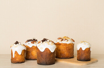Many tasty Easter cakes on wooden table