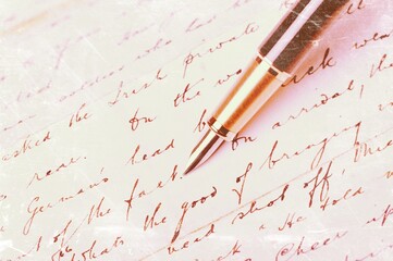 Fountain pen and antique written letter.