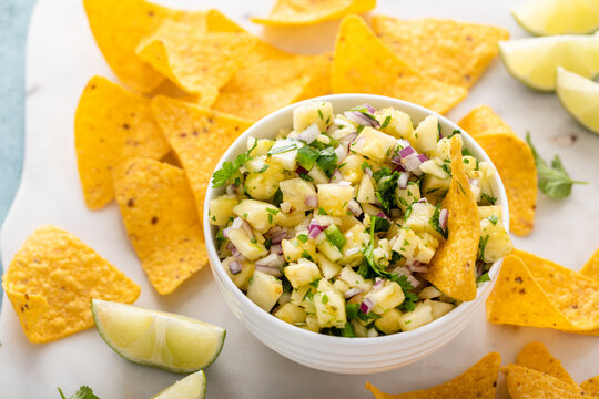 Pineapple salsa with cilantro, jalapeno and red onion served with corn tortilla chips