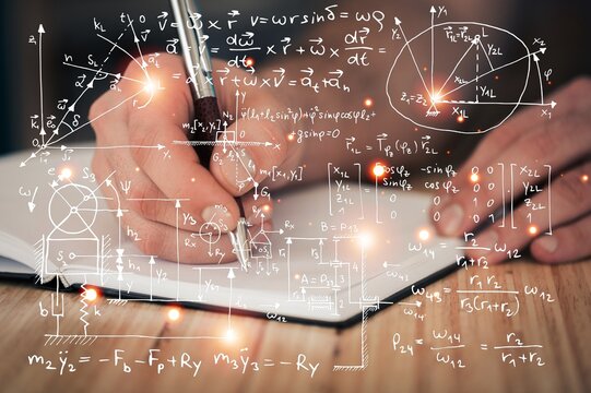 A student or scientist hold a book of physics equation - Powered by Adobe
