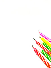 colorful birthday candles on a white background