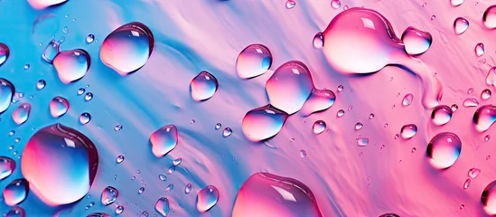 Foto op Plexiglas A macro shot of liquid droplets on a pink and azure surface, displaying shades of violet, magenta, and aqua colors © TheWaterMeloonProjec