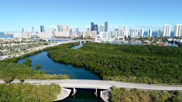 DRONE LANDSCAPE CAPTURING THE NORTH END OF OLETA RIVER, THE INTERCOASTAL WATERWAY, SUNNY ISLES BEACH AND THE ATLANTIC OCEAN.