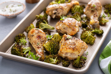 Chicken drumsticks and thighs with broccoli sheet pan dinner or lunch