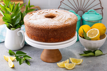 Lemon poppy seed pound cake baked in a bundt pan topped with powdered sugar