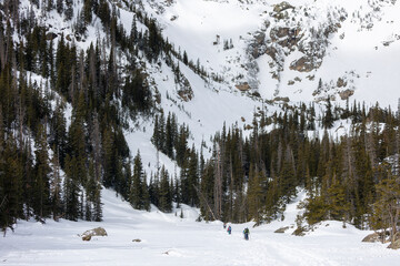 Hikers on Emerald Lake, Frozen Lake in Spring, Colorado