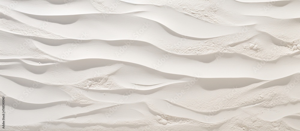 Aufkleber white wall decorated with a unique pattern resembling sand and water, creating a visually appealing 