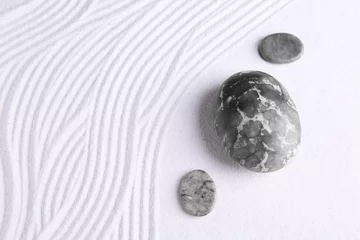 Foto op Plexiglas Zen garden stones on white sand with pattern, flat lay © New Africa