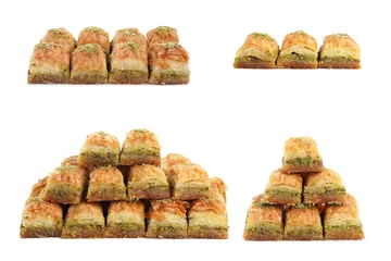 Keuken spatwand met foto Eastern sweets. Pieces of delicious fresh baklava with chopped nuts isolated on white, set © New Africa