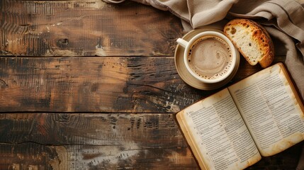 Wooden table with open bible, cup of coffee and bread