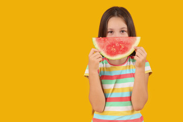 Little girl with slice of fresh watermelon on yellow background