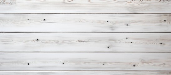 Obraz premium A closeup shot of a rectangle white hardwood table with parallel planks and wood stain pattern. The blurry background emphasizes the beauty of the wood