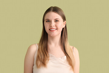 Young woman with acne problem on green background, closeup
