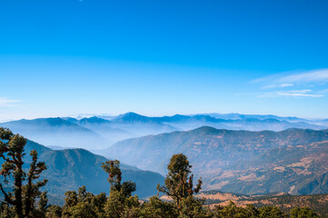 Mountains in the morning.  Scenic mystic view of Himalayan peaks such as Mt. Trishul, Mt Nanda Ghunti and Mt. Khamet. At an altitude of 3800 m. On way to Bramhatal trek, Lohajung, Uttarakhand, India