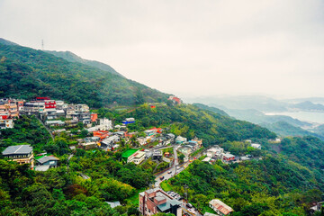 Jiufen, New Taipei, Taiwan, Republic of China, 01 22 2024: The landscape of Jiufen old street and pacific ocean