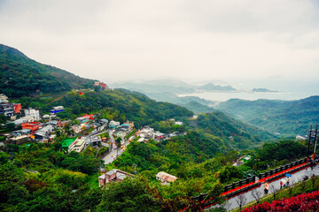 Jiufen, New Taipei, Taiwan, Republic of China, 01 22 2024: The landscape of Jiufen old street and pacific ocean  © Feng