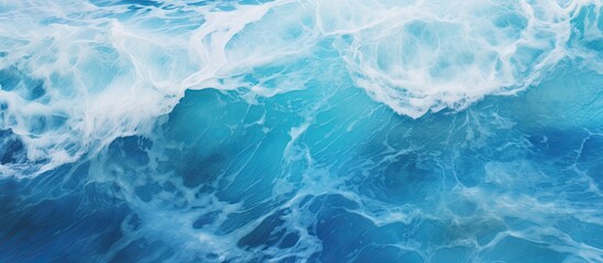 Obraz premium A close up of a wind wave in the ocean, showcasing the electric blue liquid of the water in a mesmerizing pattern. Perfect for recreation or a natural landscape in a swimming pool