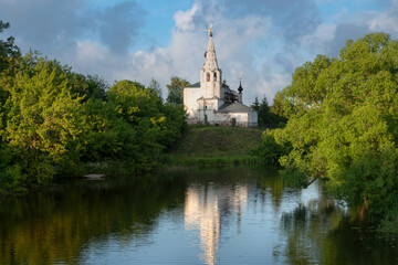 View of the Church of Cosmas and Damian on Yarunova Hill (Kozmodemyanskaya Church) on the bank of the Kamenka River on a sunny summer day, Suzdal, Vladimir region, Russia