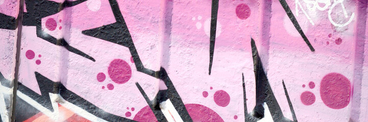 Colorful background of graffiti painting artwork with bright aerosol outlines on wall. Old school...