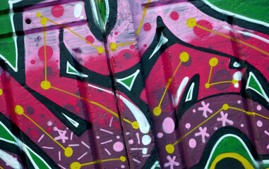 Colorful background of graffiti painting artwork with bright aerosol outlines on wall. Old school...