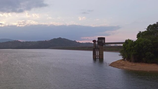 Jet ski running on waters of Presa de Hatillo dam at sunset, Dominican Republic. Aerial backward and copy space