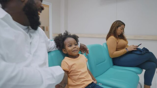 African family patient waiting medicine from pharmacy center in hospital.