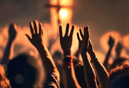 Christian worshipers raising hands up in the air