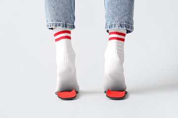 Female feet on orthopedic insoles isolated on white background