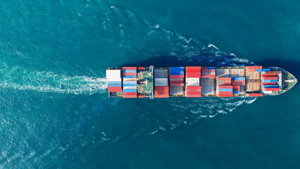 Aerial view of cargo ship with contrail in the ocean sea ship carrying container and running from container international port smart freight shipping by ship service - obrazy, fototapety, plakaty