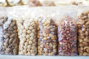 many mixed nuts in a plastic packet on shelf 